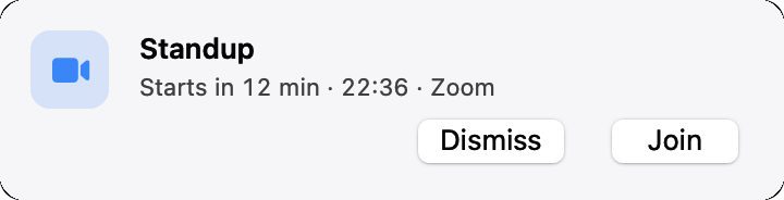 A small card at the top right of the screen: Standup starts in 12 minutes on Zoom, with Dismiss and Join
